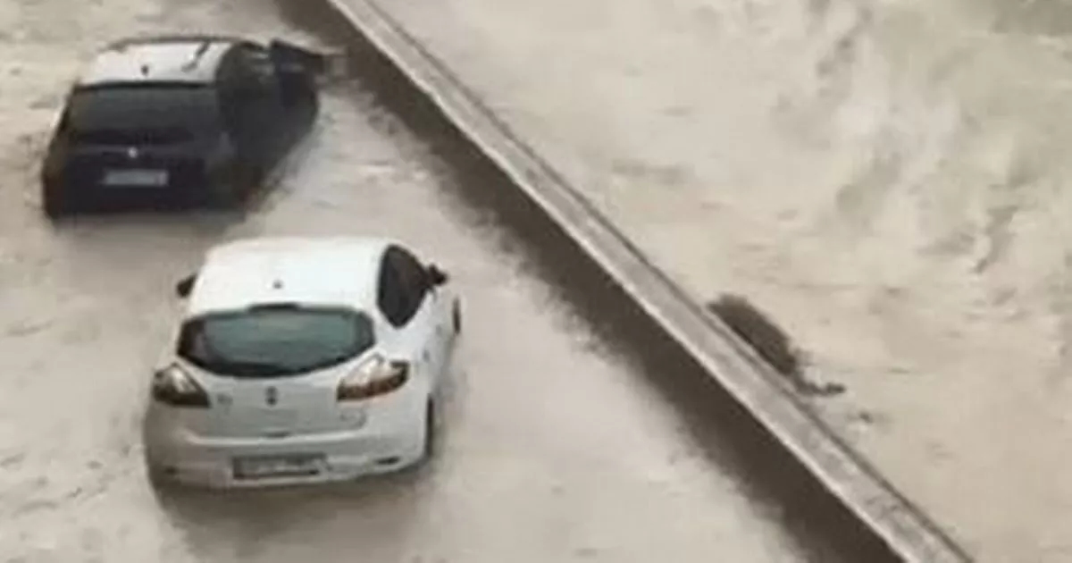 Brit holiday hotspot hit by storm and hail warning as cars left underwater