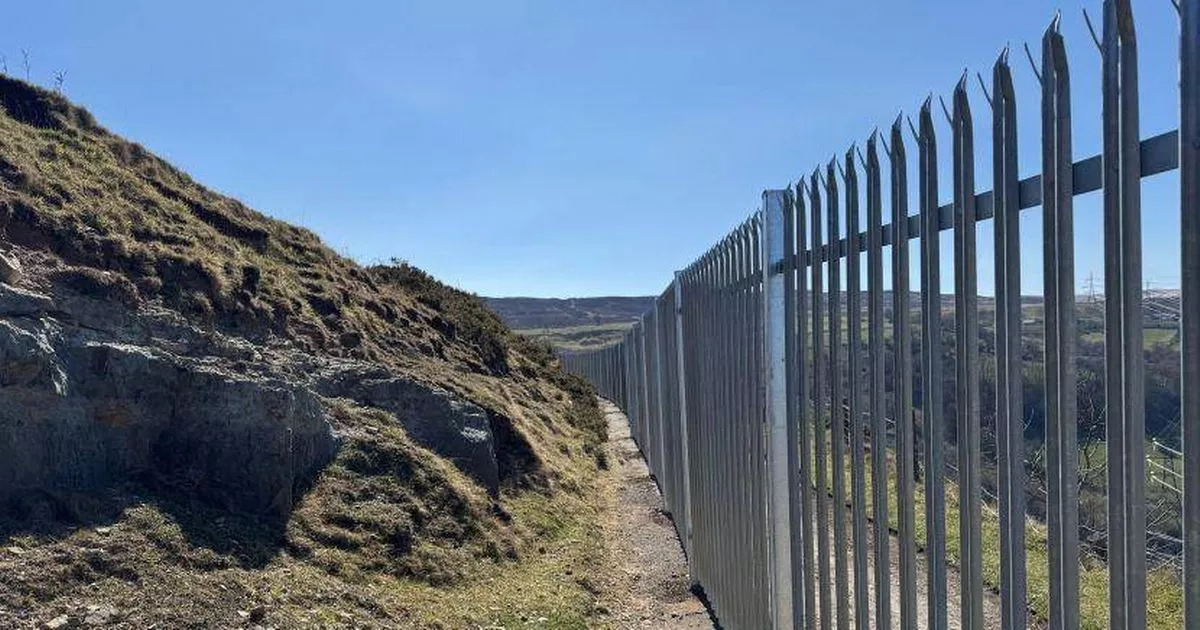 Huge row breaks out in Welsh village after 'disgusting' 2m high 'Great Wall' is built to keep people away