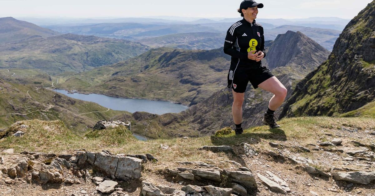 Wales manager hikes Snowdon on her own at dawn to deliver historic announcement