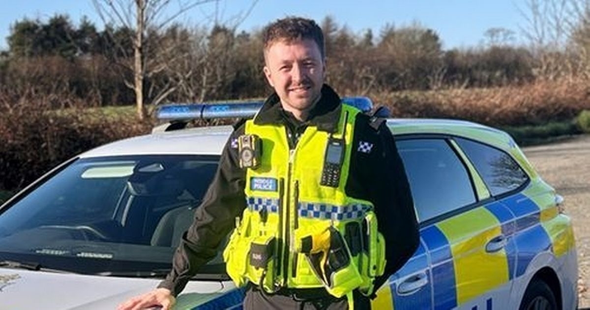 Police officer rescues driver trapped in car fire just moments before explosion