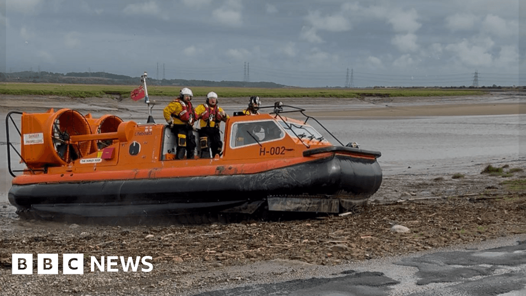 Lifeboat crew rescues two sailors in dinghy stuck in mud in heavy rain