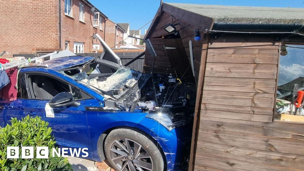 Electric car crashes into Newton Abbot garden shed