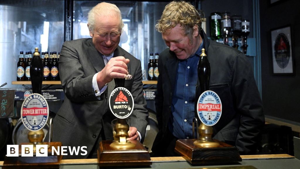 King Charles pulls pint and fits tyre as he visits Staffordshire