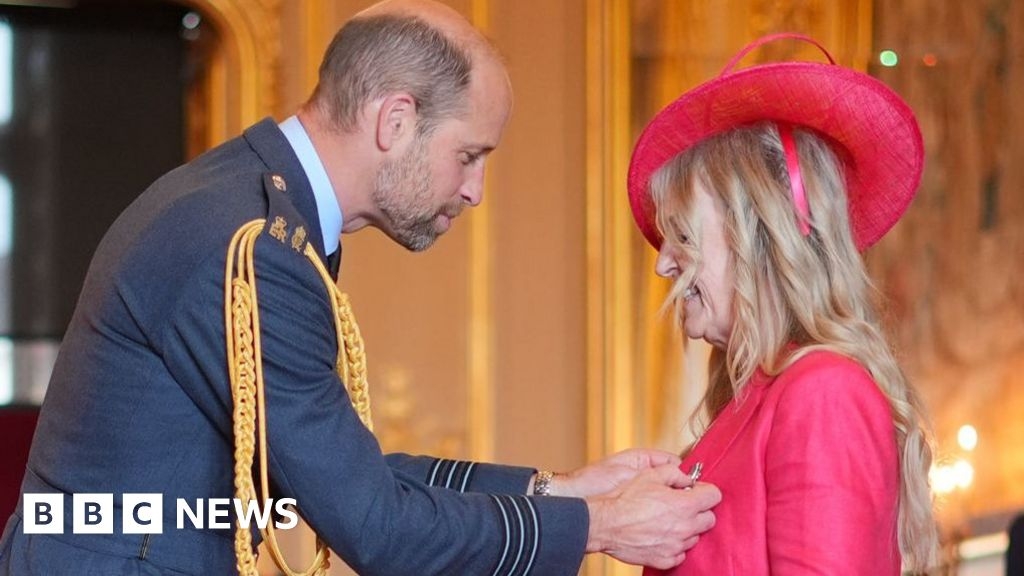 Brain injury in football campaigner receives MBE at Windsor Castle