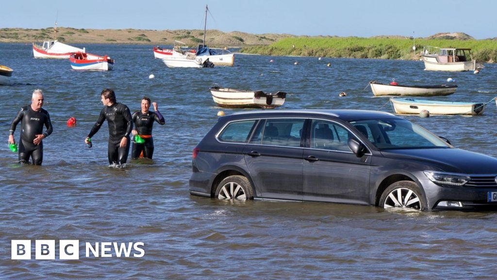 Cars stranded during high tide flooding in Burnham Overy Staithe