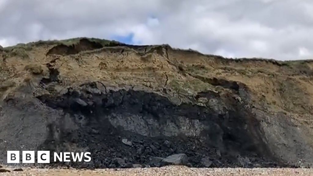 Moment of Charmouth cliff fall captured during beach walk