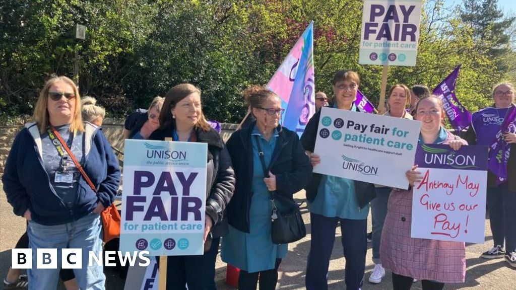 Nottingham hospital staff strike in dispute over back pay