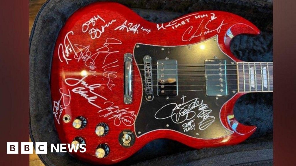 Signed Ozzy Osbourne guitar raises £15k for Acorns hospice