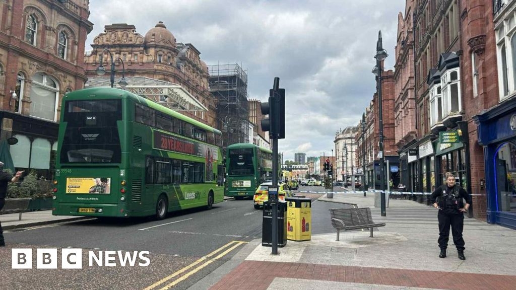 Woman hit by bus on Leeds city centre street