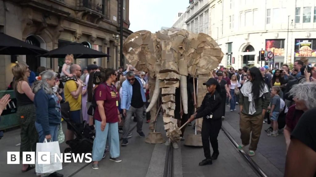 Giant wooden animal puppet parade wows Manchester