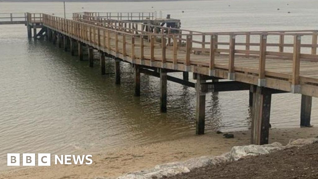 Wooden 85-year-old Poole Harbour pier reopens