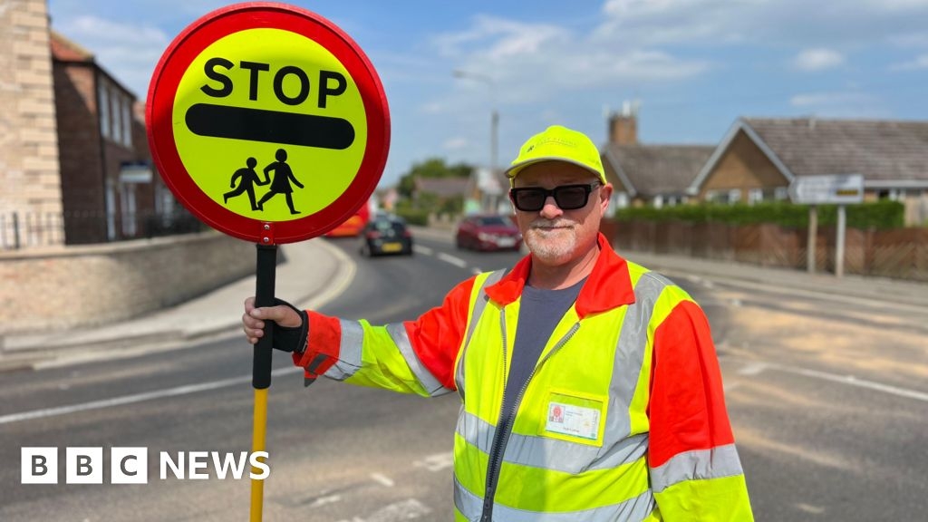Howden lollipop man told to stop giving kids high-fives