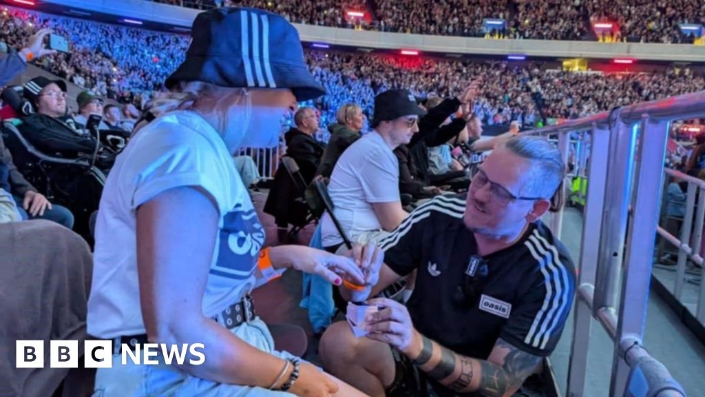 Oasis fans celebrate after Slide Away proposal at Murrayfield