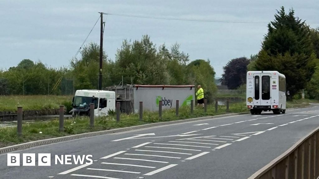 Trapped driver rescued after lorry plunges into canal in Cheshire