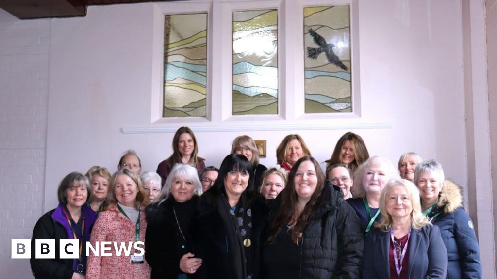Stained glass window among tributes to head teacher