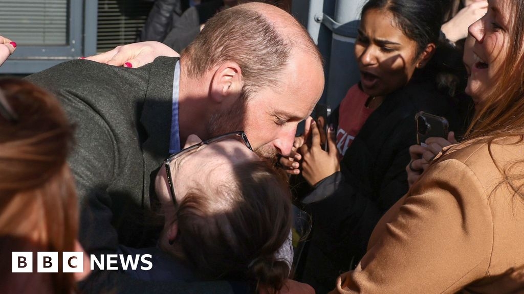 Prince William hugs student on visit to Poole college