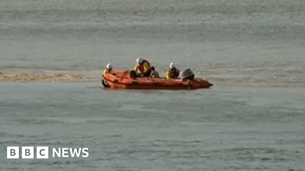 BBC TV report captures sea rescue live from beach in Norfolk