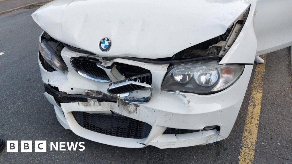 Severely damaged BMW pulled over on M25 at Potters Bar
