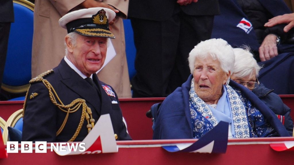 VE Day: Codebreaker sits next to King Charles at VE Day parade