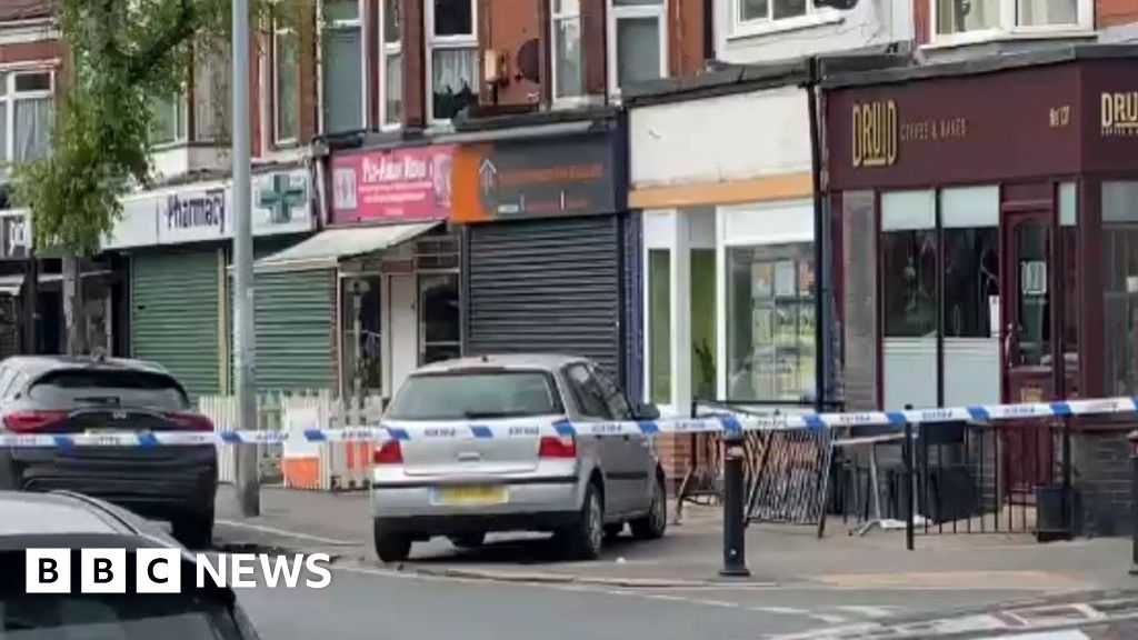 Man held after car mounts pavement and hits woman in Hull