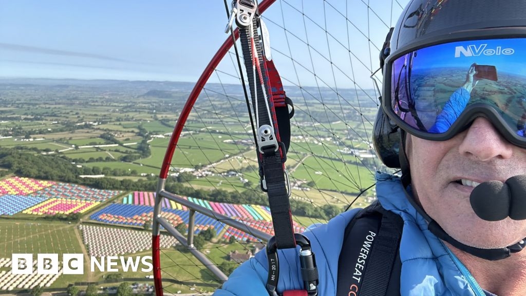 Paramotorer soars through the skies above Glastonbury Festival