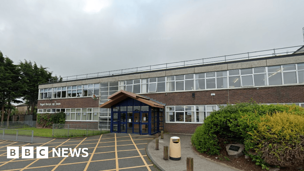 Conwy: Illegal caravan campers pitch up on school's playing fields