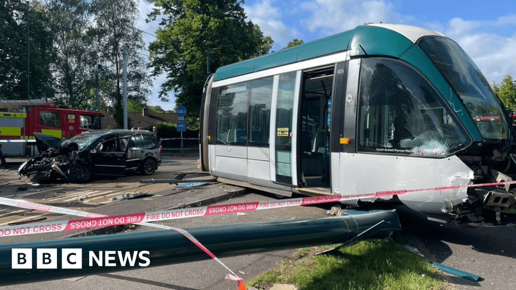 Nottingham tram derails after being hit by car