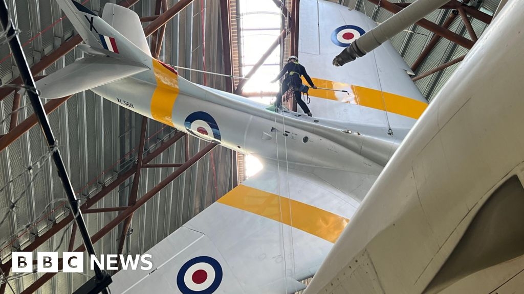 RAF Cosford cleaners abseil to dust off old war planes