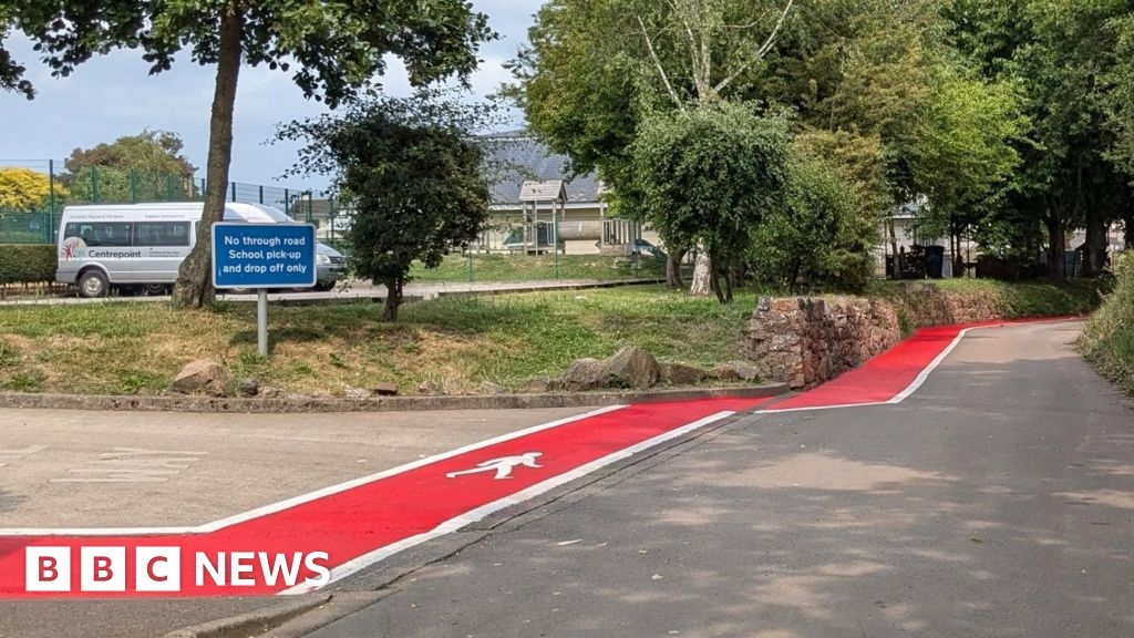 Red walking paths painted near Grouville school in Jersey
