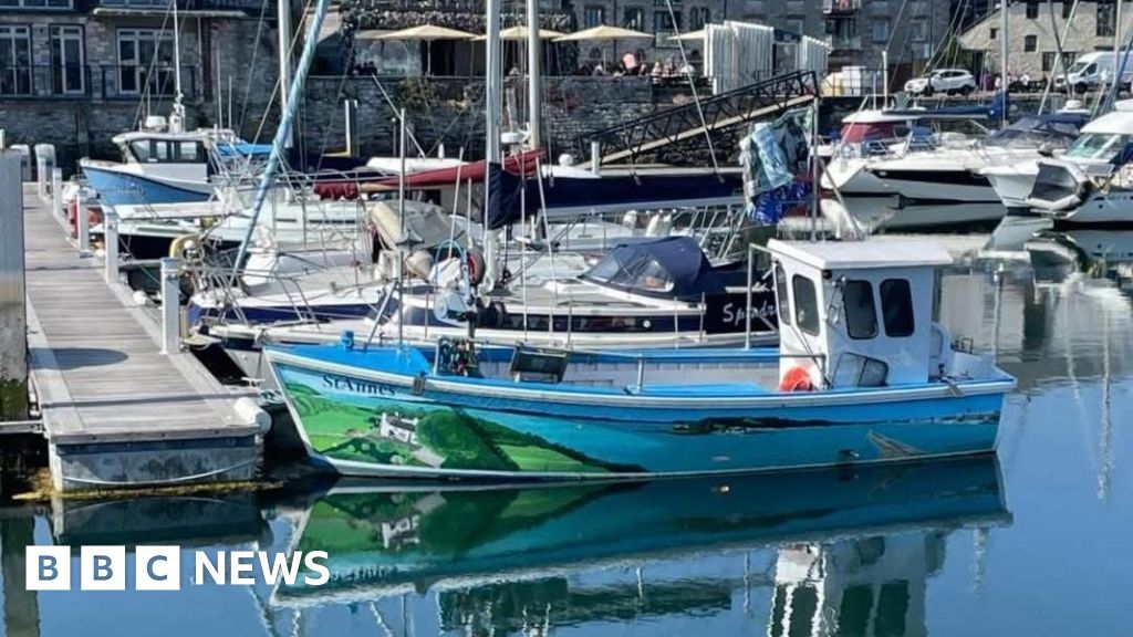 Plymouth fishing boat with striking mural sinks in harbour