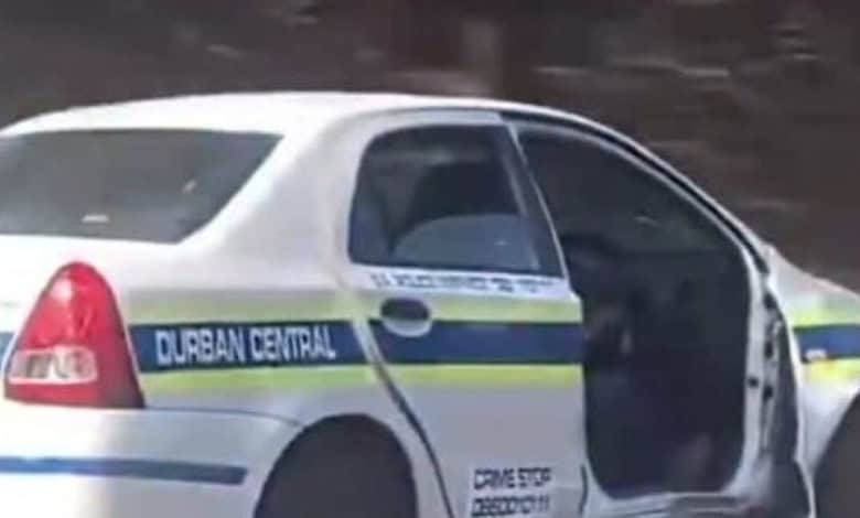 Watch: Durban cop under fire for driving doorless SAPS car