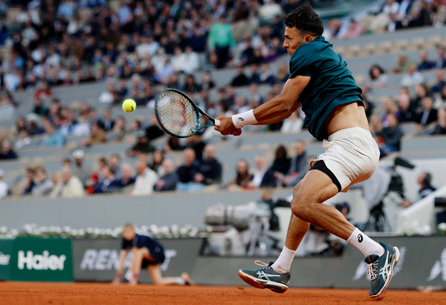 Big names crash but Italians shine on damp day at French Open