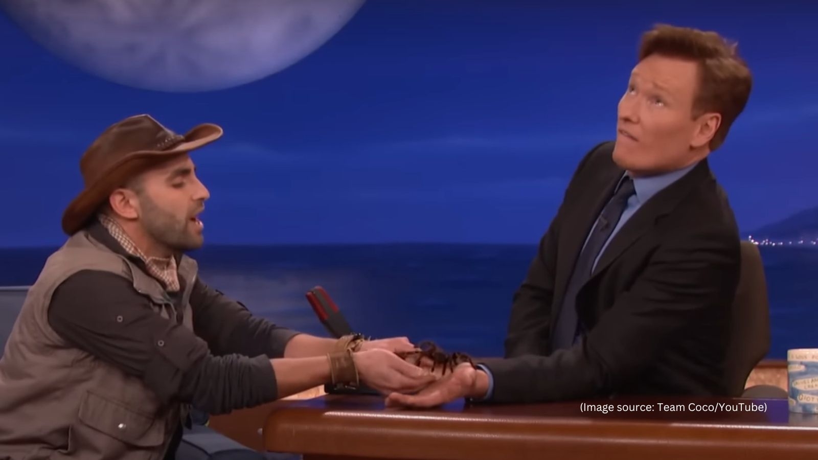 Resurfaced clip shows Conan O'Brien freezing as tarantula crawls on his wrist in hilarious moment with Coyote Peterson