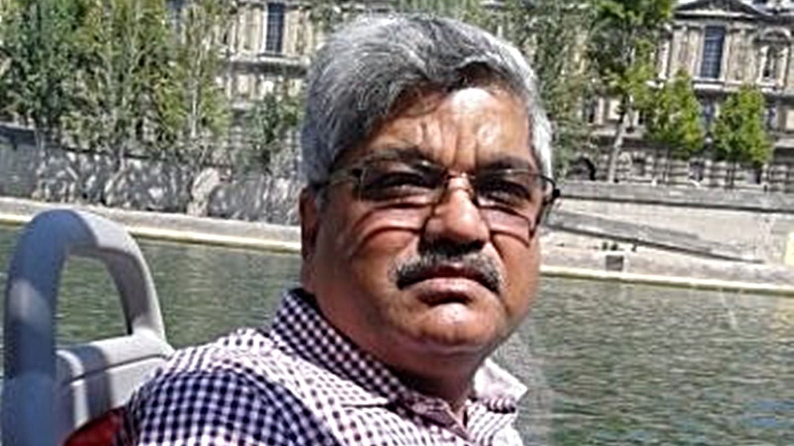 Who is IP Gautam, the retired IAS officer appointed to oversee the Gandhi Ashram development project