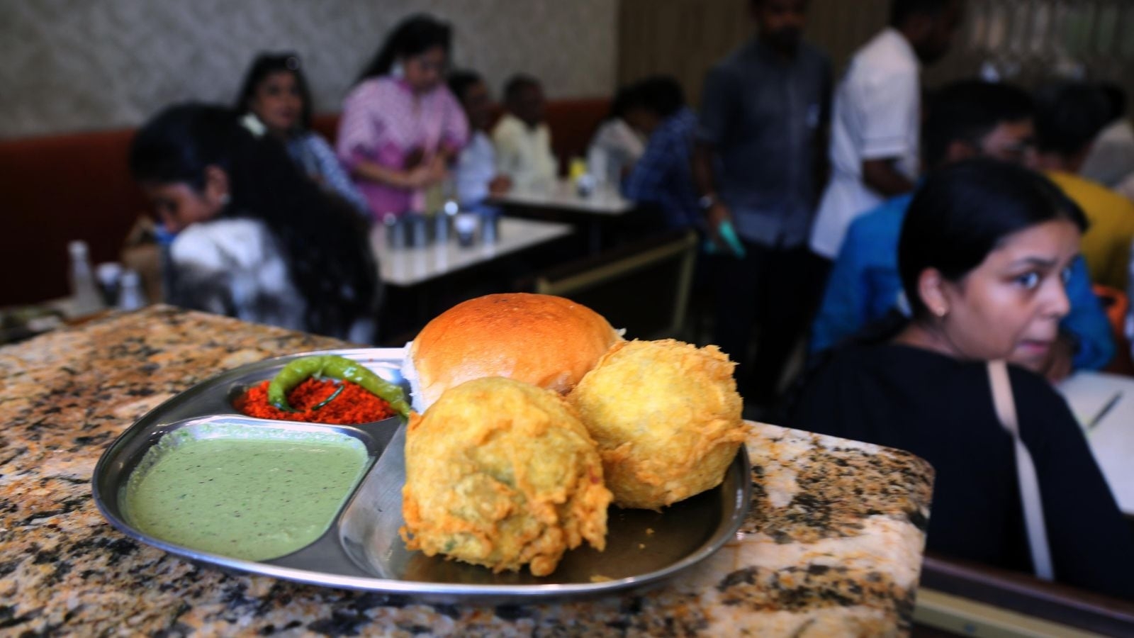 Around Town: Why Mumbaikars queue up daily at this 86-year-old iconic vada pav outlet near CST