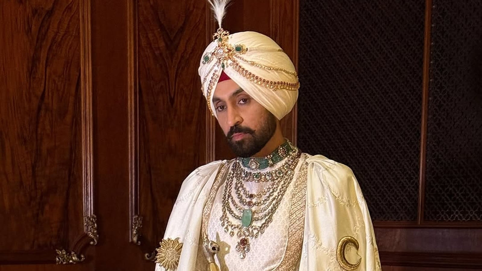 Diljit Dosanjh debuts his ‘Maharaja of Patiala' look at the Met Gala in a white cape with the Punjabi mool mantra and the state's map embroidered on it