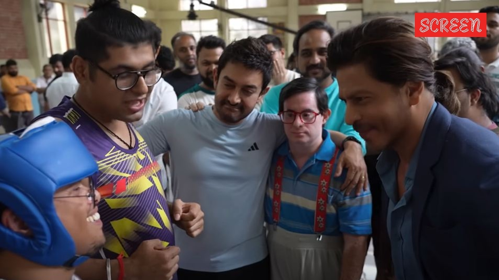 Shah Rukh Khan embraces the cast and poses for pictures at Sitaare Zameen Par screening. Watch video