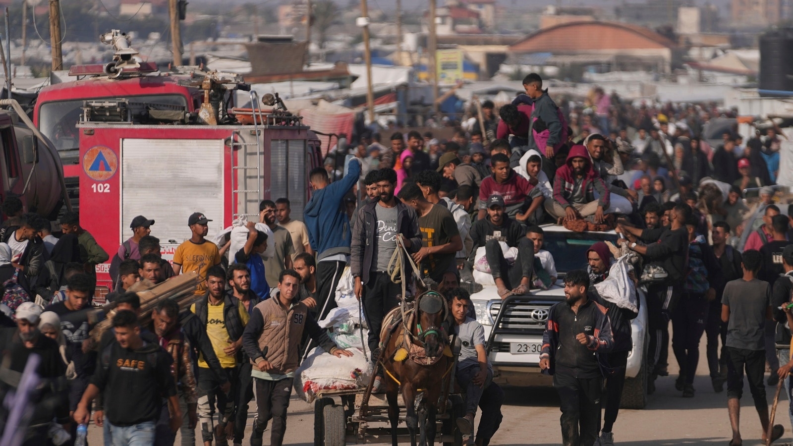 Israeli forces open fire a kilometer away from Gaza aid site, killing 3, health officials say