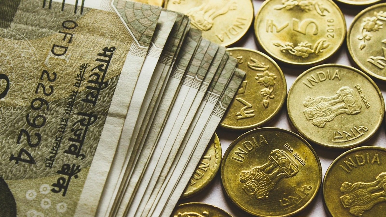 Rupee surges to biggest single-day high in a month, rises 77 paise to close at 85.98 against US dollar as oil prices ease