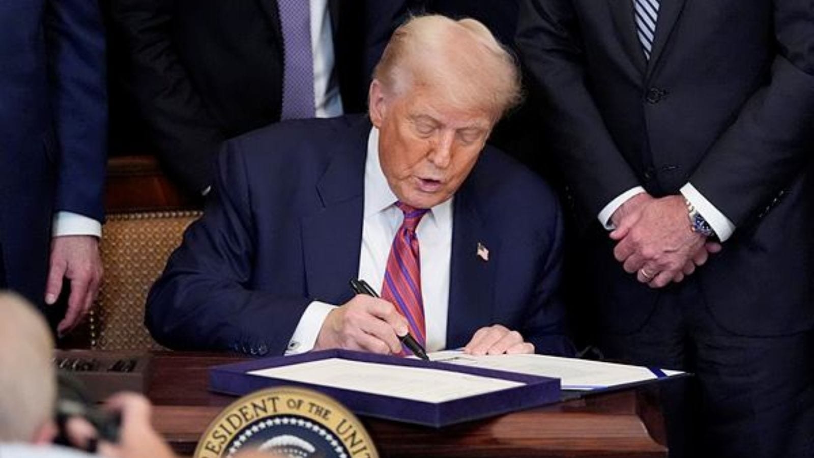 Trump signs stablecoin law as crypto industry aims for mainstream adoption