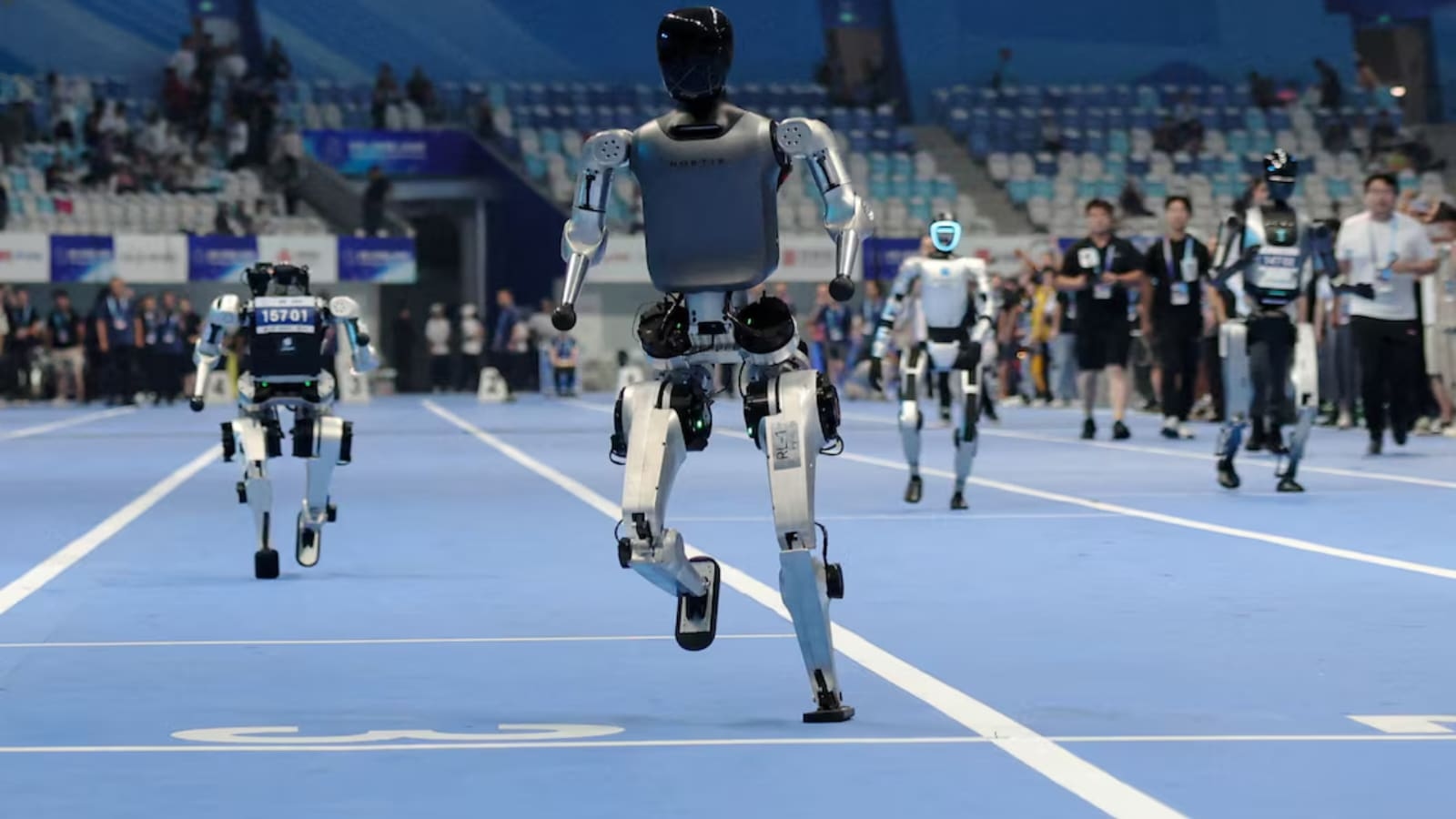 China's ‘robot Olympics' sees humanoids from 16 nations compete in table tennis, football, track