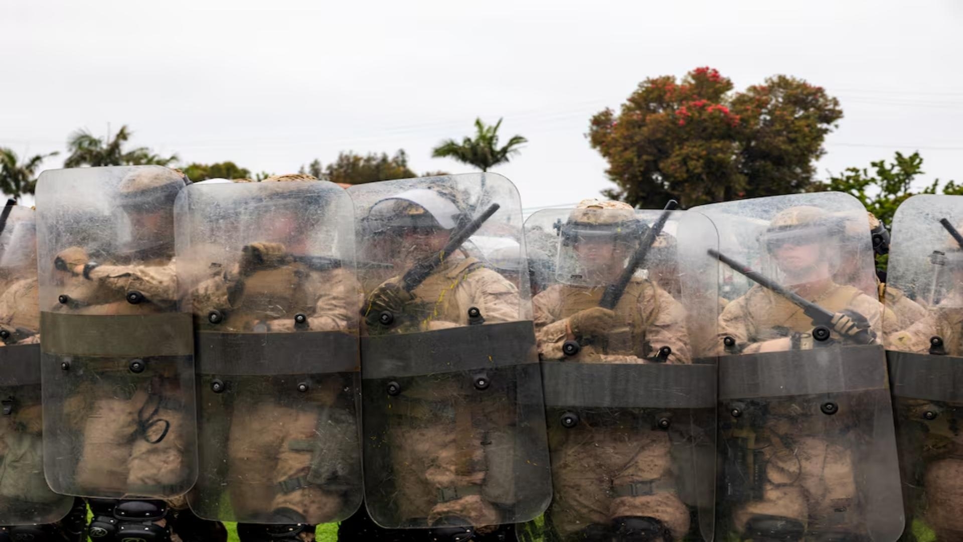 Troops in LA can detain individuals, military official says, as protests spread across US