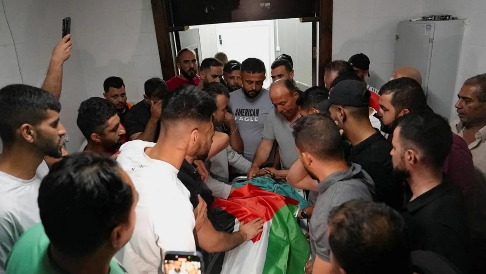 Israeli settlers raid West Bank town, troops kill 3 Palestinians