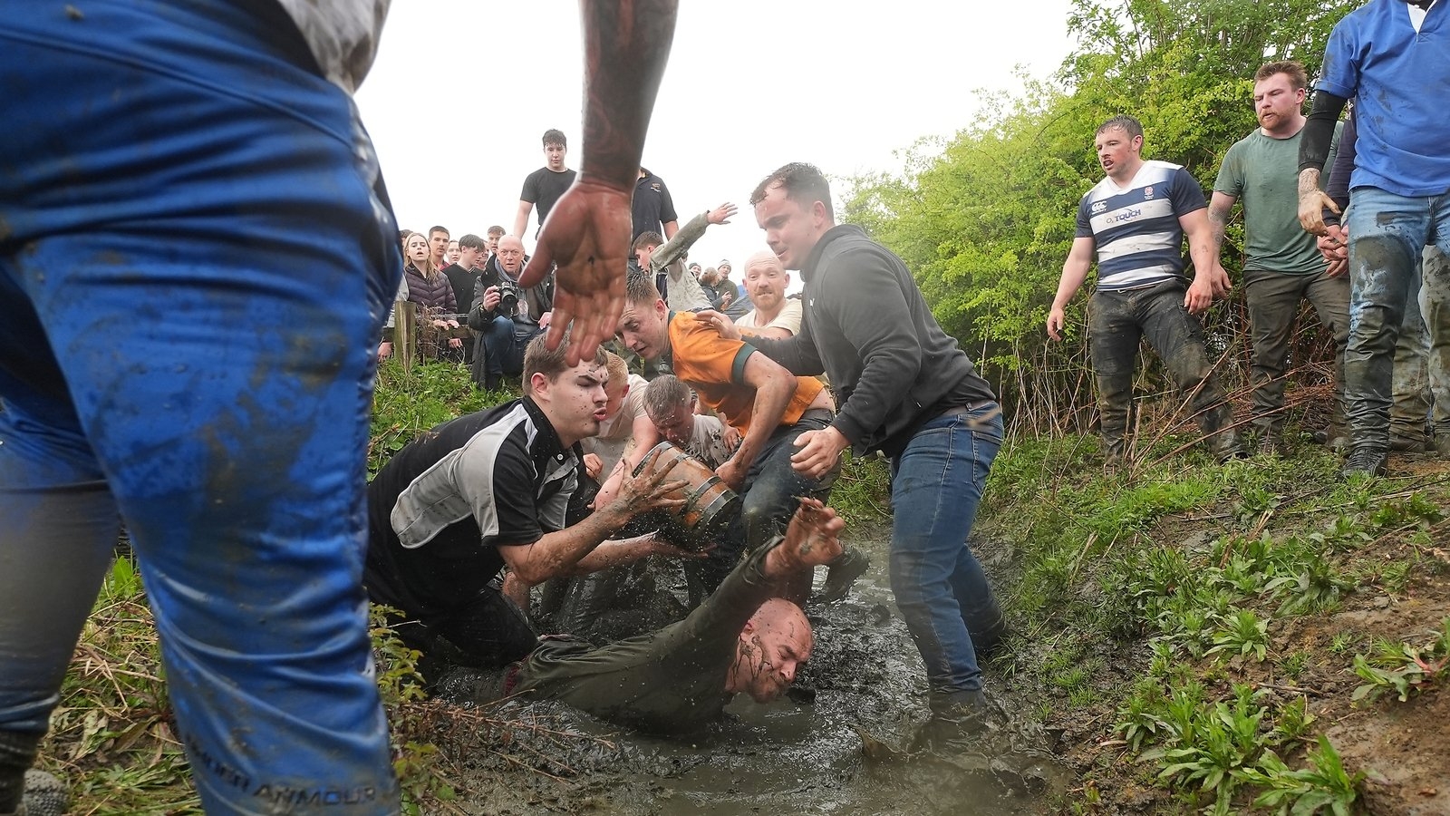 Two UK villages compete in annual bottle kicking contest