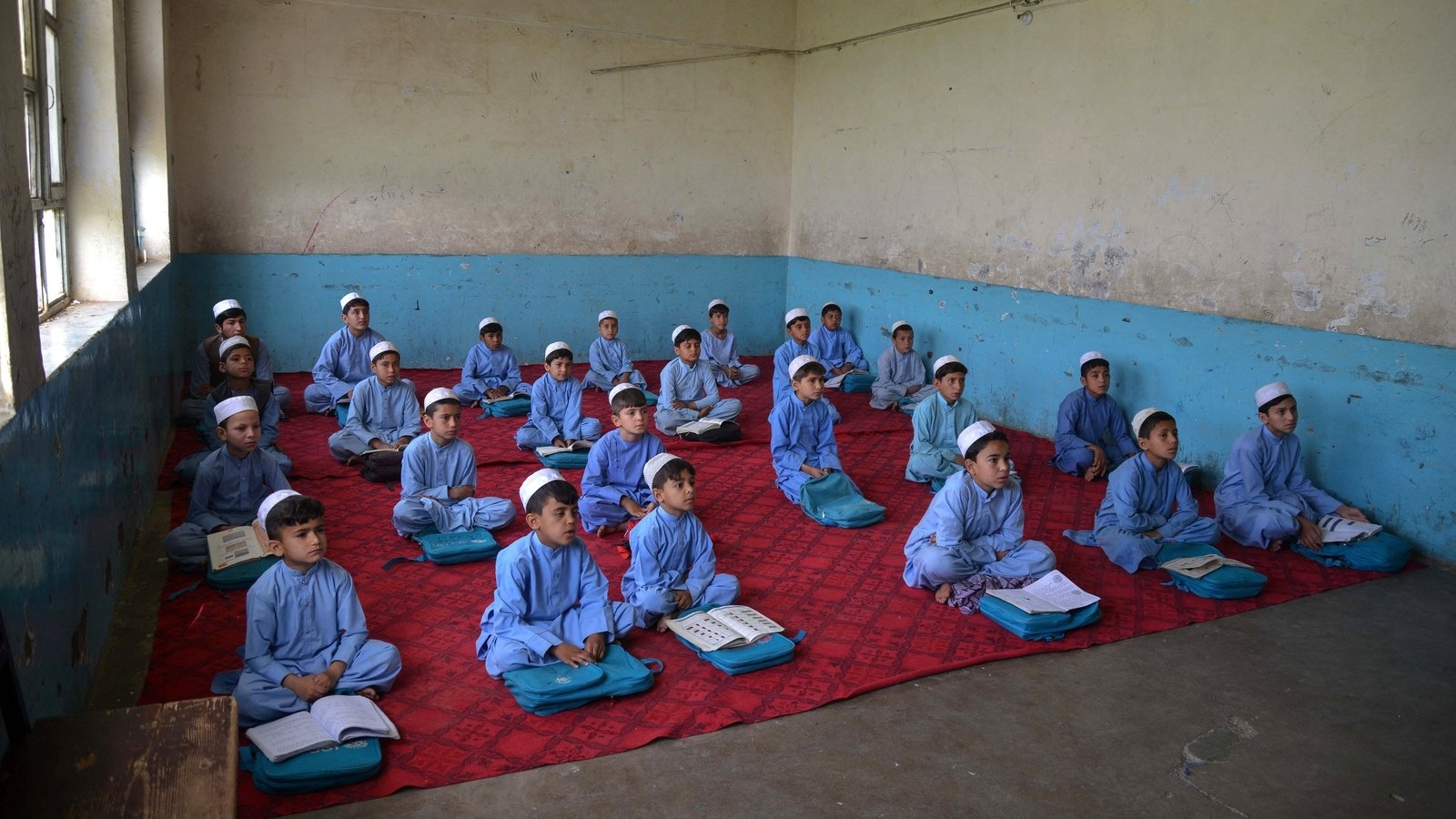 Tunics & turbans: Afghan students don Taliban-imposed uniforms