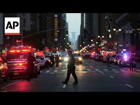 Gunman kills 4, including police officer, in shooting at NYC office tower
