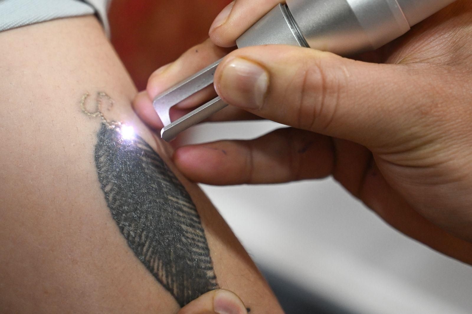 Fearing Indian police, Kashmiris scrub 'resistance' tattoos