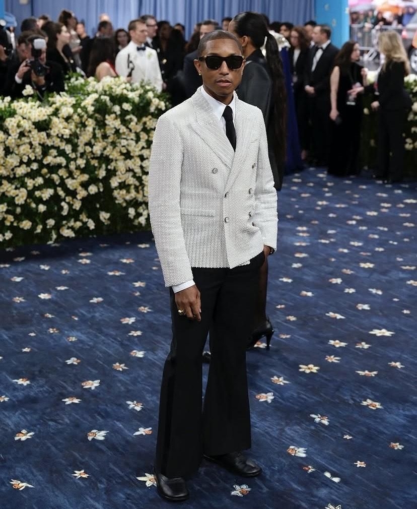 Shining bright: Pharrell Williams' gold retainers redefine style at the Met Gala