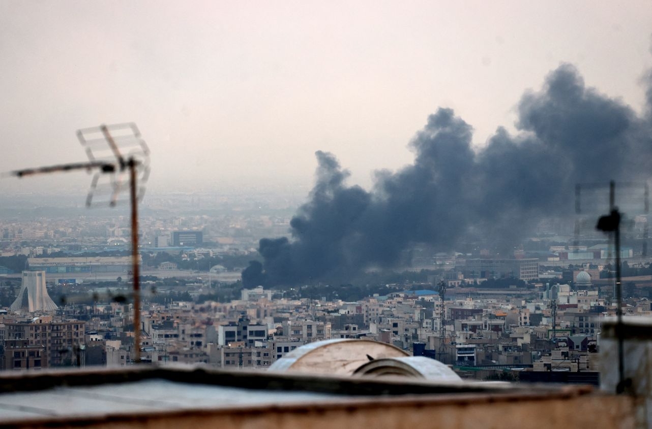 Israel, Iran trade missile fire as Trump warns Tehran to 'evacuate'