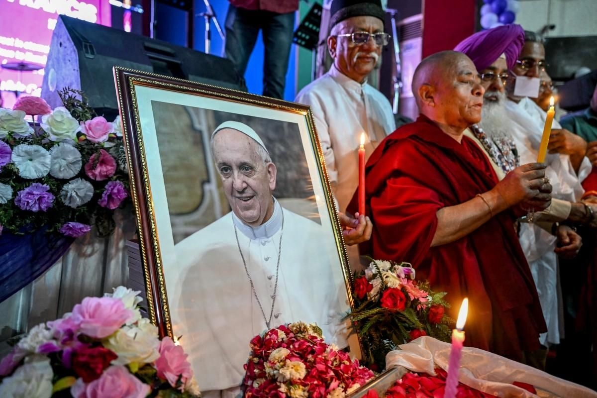 Tens of thousands bid farewell to Pope Francis as he lies in state